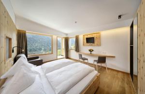 Postel nebo postele na pokoji v ubytování Hotel Sonne