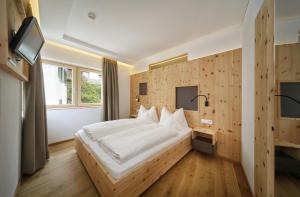Postel nebo postele na pokoji v ubytování Hotel Sonne