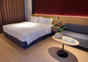 Katil atau katil-katil dalam bilik di Maison New Century Tongxiang