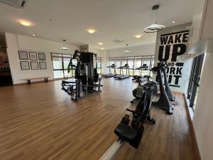 a gym with treadmills and machines in a room at CT View Homestay by Ifaizal, Presint 15 Putrajaya in Putrajaya