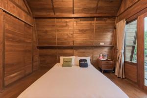 Ένα ή περισσότερα κρεβάτια σε δωμάτιο στο Urbanview Hotel Cianjur City Park by RedDoorz +29 φωτογραφίες
