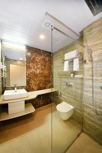 Vannituba majutusasutuses Woodapple Hotel and Spa