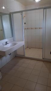 a bathroom with a sink and a shower at Ivan Garden B&B in Hengchun