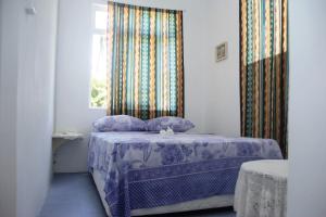 Кровать или кровати в номере La Villa Allamanda