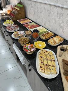 a buffet line with many different types of food at Hotel Sevinch in Tashkent