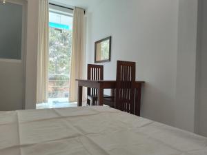 Letto o letti in una camera di VThree Family House
