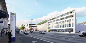 a rendering of a building on a city street at Adapt Apartments Wetzlar in Wetzlar