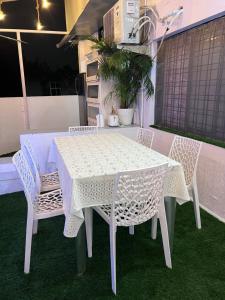 a white table and chairs on a patio at Twin Room in Nagpur