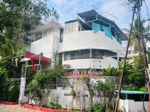 a building with scaffolding on the side of it at Twin Room in Nagpur