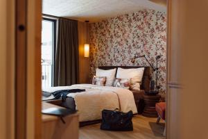 Ένα ή περισσότερα κρεβάτια σε δωμάτιο στο Boutique Hotel Das Rivus