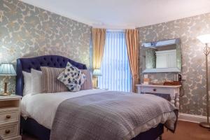 Una cama o camas en una habitación de Sunnyside Guest House