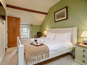 a bedroom with a large white bed and a window at 4 Bed in York G0091 