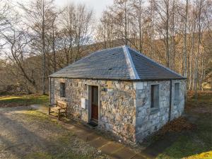 a small stone building on the side of a road at 1 Bed in Applecross CA186 in Applecross