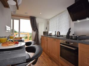 a kitchen with a plate of food on a counter at 1 Bed in Bideford 74817 in Bideford