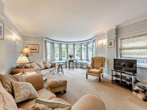 a living room with a couch and a tv at 4 Bed in Totland Bay IC032 in Totland