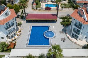 an overhead view of a swimming pool in a resort at Calis Beach Random Rooms by LookBookHoliday in Fethiye