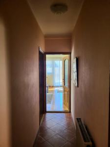 a hallway with a door leading to a room at Apartments center Zorić in Žabljak
