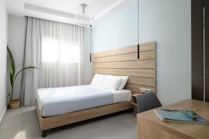 Llit o llits en una habitació de Anasa Luxury Villas