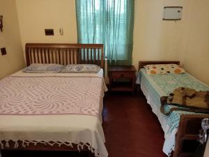 Postel nebo postele na pokoji v ubytování Adams Wood House Ayurveda Homestay Kochi