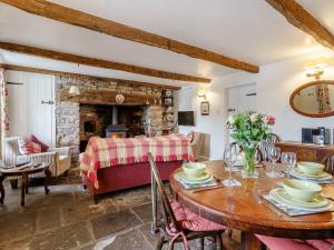 a living room with a table and a fireplace at 2 bed in Llangynidr BN023 in Llangynidr