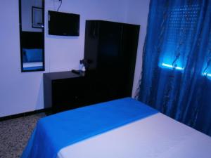 Postel nebo postele na pokoji v ubytování Hostal Don Pepe
