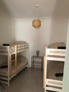 Poschodová posteľ alebo postele v izbe v ubytovaní Casa Jalena