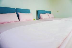 Postel nebo postele na pokoji v ubytování Chuncheng B&B