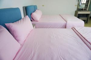 Postel nebo postele na pokoji v ubytování Chuncheng B&B