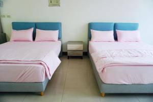 Postel nebo postele na pokoji v ubytování Chuncheng B&B