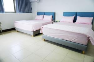 Llit o llits en una habitació de Chuncheng B&B