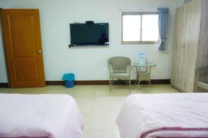 Postel nebo postele na pokoji v ubytování Chuncheng B&B