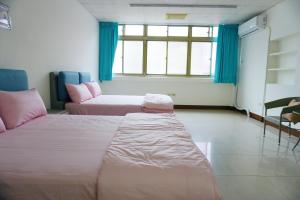 Postel nebo postele na pokoji v ubytování Chuncheng B&B