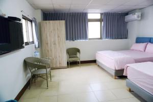 Postel nebo postele na pokoji v ubytování Chuncheng B&B
