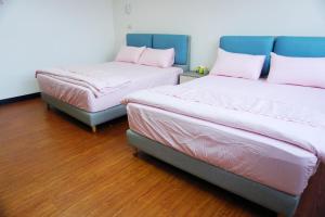 Postel nebo postele na pokoji v ubytování Chuncheng B&B