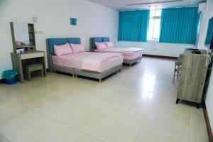 Postel nebo postele na pokoji v ubytování Chuncheng B&B