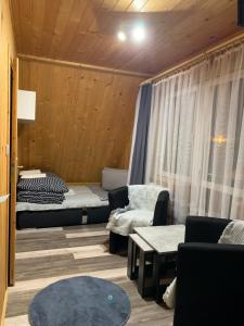 Postel nebo postele na pokoji v ubytování Apartament Busia