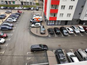 an aerial view of a parking lot with cars at Stan na dan Pale Apartman Danica in Pale