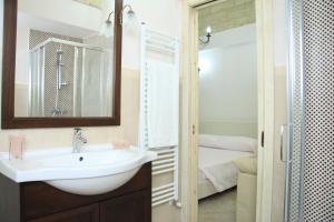 a bathroom with a sink and a shower at Corte Della Luna in Acquarica del Capo +79 photos
