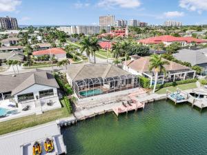 an aerial view of a house with a marina at Waterfront home with views, pool and walk to beach in Marco Island