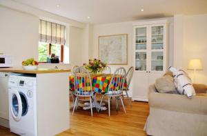 a kitchen and living room with a washing machine at Pleasure Row in Alton