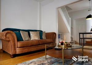 a living room with a brown couch and a table at Stylish 2 Bed House In The Heart Of Clitheroe By Smooth Stays Short Lets & Serviced Accommodation With Parking in Clitheroe