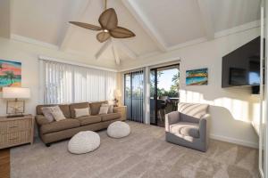 a living room with a couch and a ceiling fan at Shores Of Maui 224 in Kihei