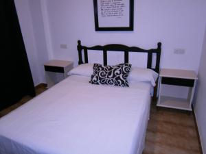 Postel nebo postele na pokoji v ubytování Hostal Don Pepe