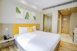 Postel nebo postele na pokoji v ubytování Bloom Hotel - Karol Bagh