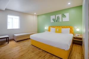 Postel nebo postele na pokoji v ubytování Bloom Hotel - Karol Bagh