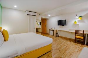 Postel nebo postele na pokoji v ubytování Bloom Hotel - Karol Bagh