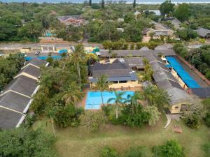 an aerial view of a resort with a pool at Manzini chalets 8-9-10-37 in St Lucia