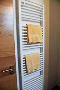 a towel rack with two towels in a bathroom at Ferienwohnung "Zur Krone" - zentrale Lage - NEU - in Zell im Wiesental