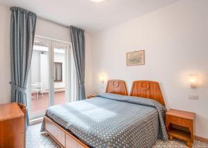 Postel nebo postele na pokoji v ubytování Hotel Eliseo Park's