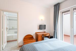 Postel nebo postele na pokoji v ubytování Hotel Eliseo Park's